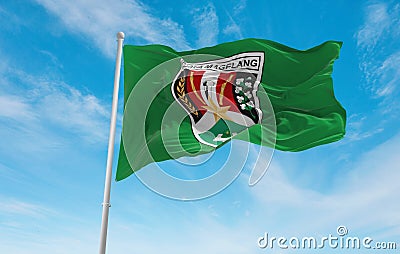 official flag of Magelang City Indonesia at cloudy sky background on sunset, panoramic view. Indonesian travel and patriot concept Cartoon Illustration