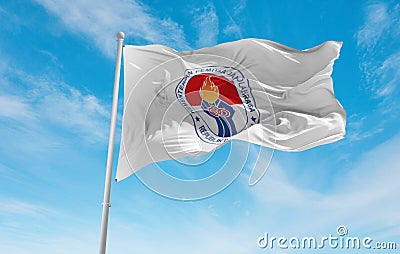 official flag of Ministry of Youth and Sport Indonesia at cloudy sky background on sunset, panoramic view. Indonesian travel and Cartoon Illustration