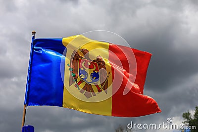 The official flag of the state of the Republic of Moldova against the sky Stock Photo