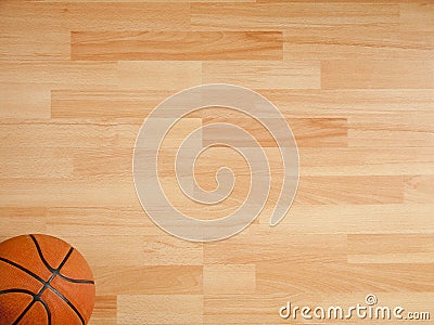 An official orange ball on a basketball court Stock Photo