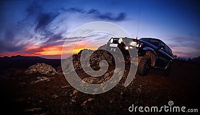 Offroad car on mountain road Stock Photo