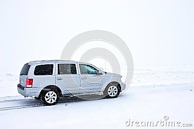 Offroad Car on the Snowy Road Stock Photo