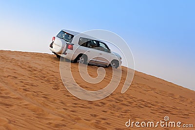 Offroad Desert Safari - Dune bashing with 4x4 vehicle in the Arabian sand dunes, Dubai, UAE Stock Photo