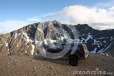 Offroad vehicle high in the Coast Mountains of British Columbia. Stock Photo