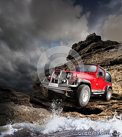 Offroad vehicle on the mountain terrain Stock Photo