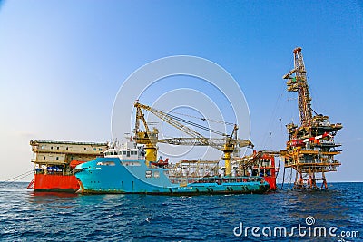 Offshore construction platform for production oil and gas. Oil and gas industry and hard work. Stock Photo