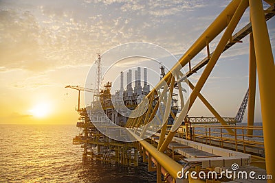 Offshore construction platform for production oil and gas. Oil and gas industry and hard work. Production platform and operation Stock Photo