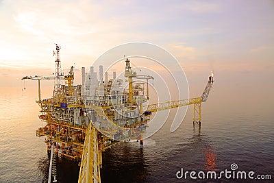 Offshore construction platform for production oil and gas. Oil and gas industry and hard work. Stock Photo
