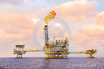 Offshore construction platform for production oil and gas, Oil and gas industry and hard work,Production platform and operation Stock Photo