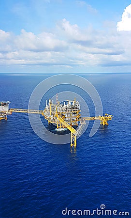 Offshore construction platform for production oil and gas, Oil and gas industry and hard work,Production platform and operation Stock Photo