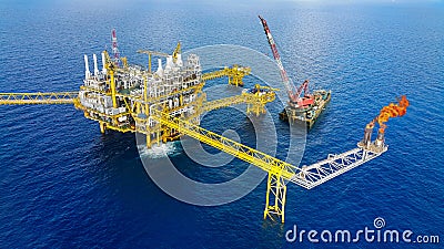 Offshore construction platform for production oil and gas, Oil and gas industry and hard work,Production platform and operation Stock Photo