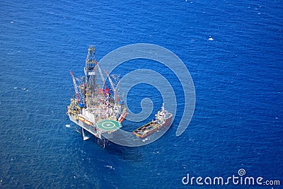 The offshore drilling oil rig top view from aircraft. Stock Photo