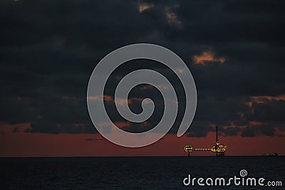 Offshore drilling rig under construction. Oil industry structure. Oil platform at night Stock Photo