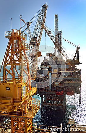 Offshore exploration, crane at work during construction Stock Photo