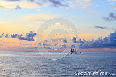 Offshore jack up drilling rig in the middle of the ocean Stock Photo