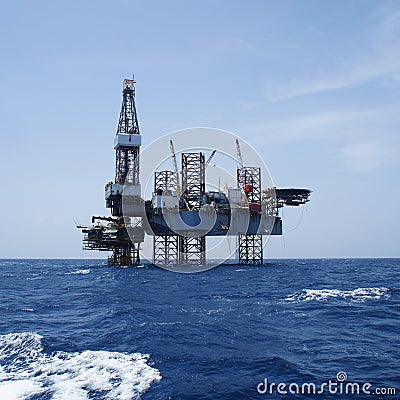 Offshore Jack Up Oil Drilling Rig and The Production Platform Stock Photo