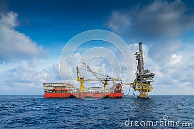 Offshore oil and gas production and exploration, tender rig work over remote platform to completion gases and crude oil wells. Stock Photo