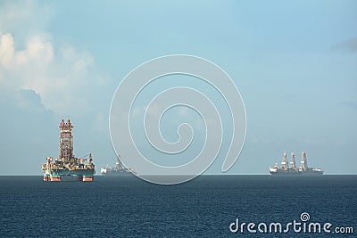 Offshore oil rig and drilling vessels in Chaguaramas Bay, Trinidad and Tobago working on oil industry project. Stock Photo