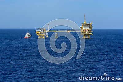 The offshore oil rig and supply boat Stock Photo