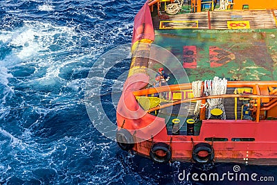 An anchor handling tug boat performing anchor handling activities at oil field Editorial Stock Photo