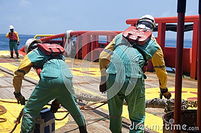 Offshore vessel crew working on deck Editorial Stock Photo