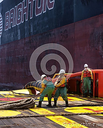 Offshore vessel crew working on deck Editorial Stock Photo