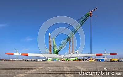 Offshore wind energy supply vessel loading rotor Stock Photo