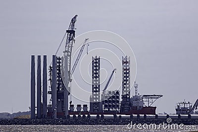 Offshore wind farm turbine construction. Supply vessel ship. Stock Photo