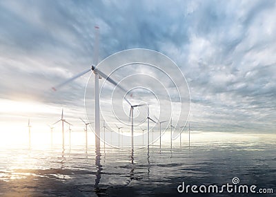 Offshore wind power plants with sunset stormy sky in background Stock Photo