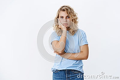 Oh my god distaster. Portrait of shocked girl in stupor leaning on palm and staring speechless at camera as being Stock Photo