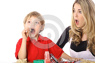 Oh NO child tasting cookie batter Stock Photo