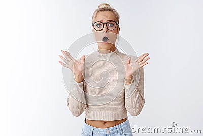 Oh no, disaster. Portrait of shocked anxious and overwhelmed worried european woman with blond hair in glasses gasping Stock Photo