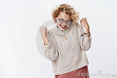 Oh yes baby I did it. Happy accomplished and thrilled joyful woman celebrating victory or success clenching fists in Stock Photo