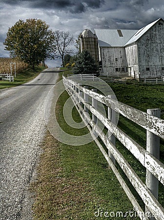 Ohio Amish Country with a barn and a white fence Stock Photo