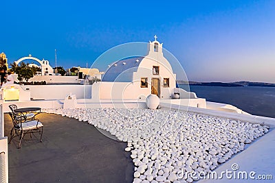 Oia town, Santorini island, Greece at sunset. Traditional and fa Stock Photo