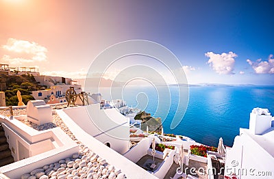 Oia town on Santorini island, Greece. Traditional and famous houses and churches with blue domes over the Caldera. Stock Photo