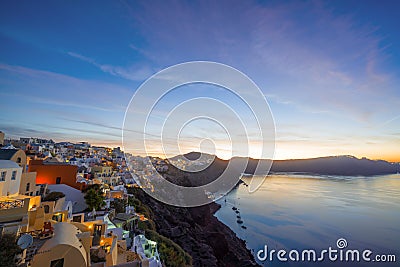 Oia village at the Santorini Island at sunset Stock Photo