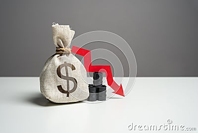 Oil barrels and dollar money bag and red arrow down Stock Photo