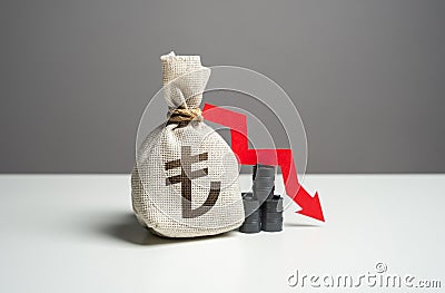 Oil barrels and turkish lira money bag and red arrow down. Stock Photo