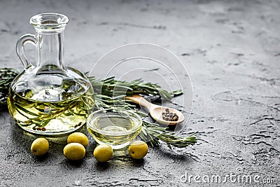 Oil in carafe with spices and olive on stone background mock-up Stock Photo