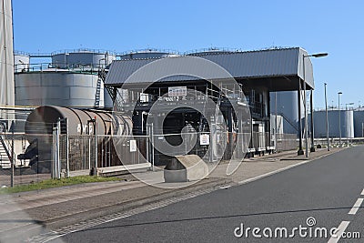 Oil and chemical tanks at the terminal of Koole in the Botlek Harbor of Rotterdam Editorial Stock Photo