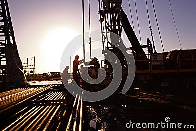 Oil drilling exploration, the oil workers are working Editorial Stock Photo