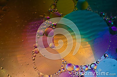 Oil drops on water with a colorful background Stock Photo