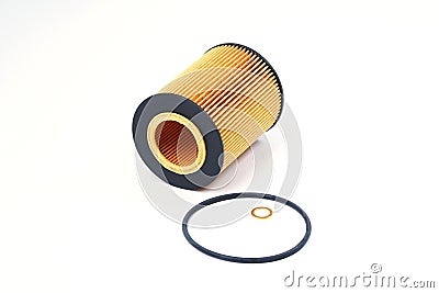 The oil filter lies with a sealing ring on a white background. Stock Photo