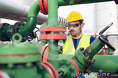 Oil and gas and pipelines with engineer talking in phone Stock Photo