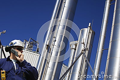 Oil and gas worker with large gas pipelines Stock Photo