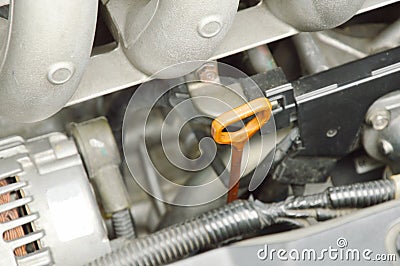oil gauge stick for checking lubricant level in car engine Stock Photo