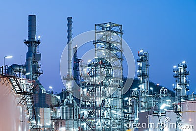 Oil Industry Refinery factory at Sunset, Petroleum Stock Photo