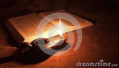 Oil lamp and Bible Stock Photo