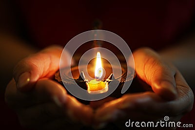 Oil lamp in hands Stock Photo